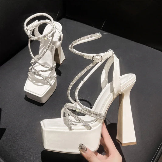 Sandales femme Eilyken sexy à bout carré, avec bande étroite en cristal, design élégant, plateforme à talons hauts épais, idéales pour banquets et soirées.